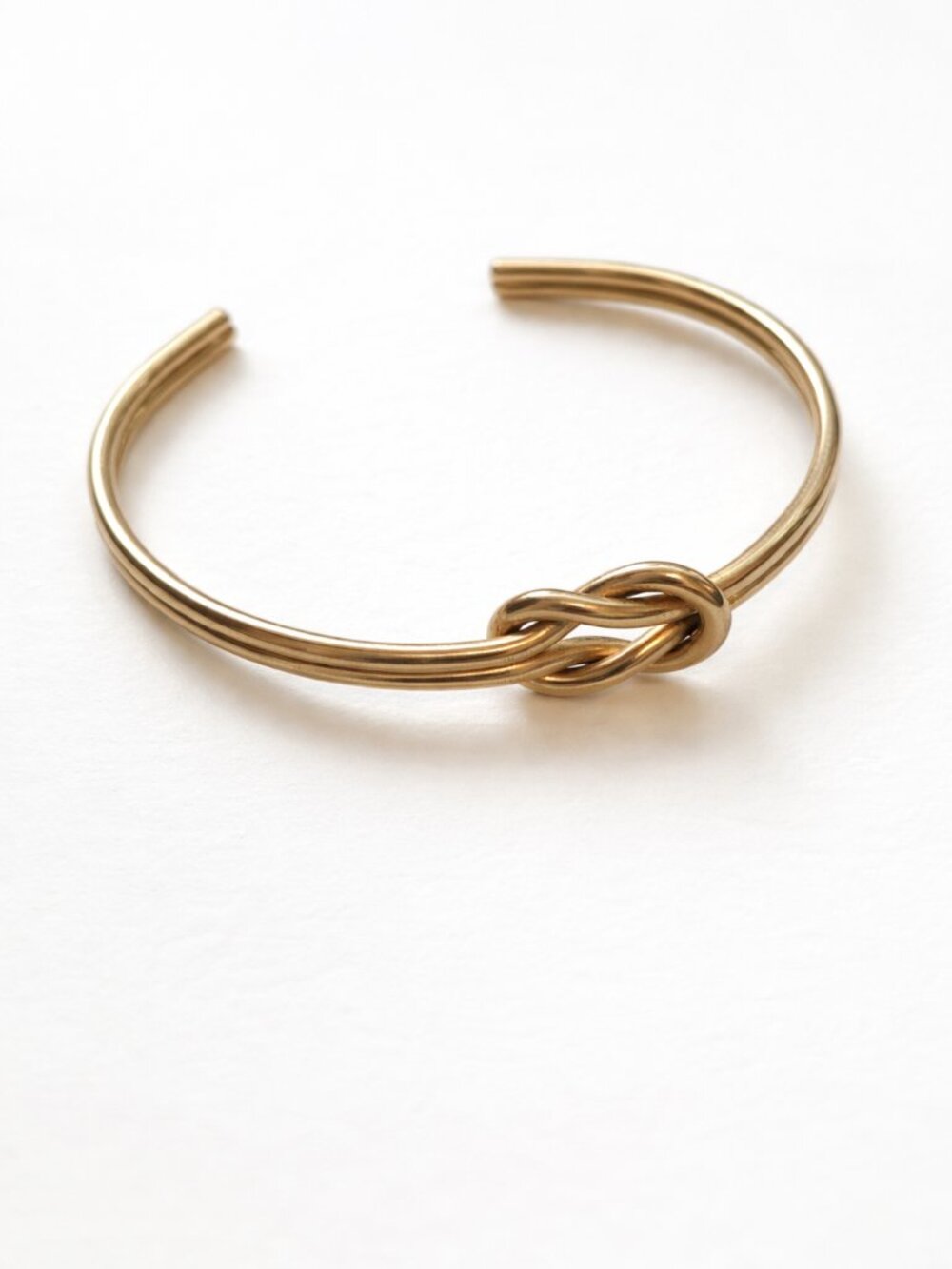Minimalist Gold tone quiet luxury knotted bracelet